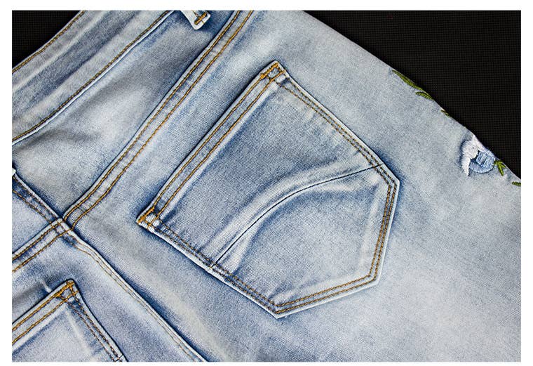 Floral embellished flare light blue jeans