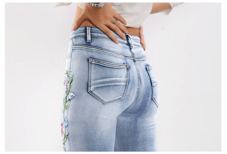 Floral embellished flare light blue jeans